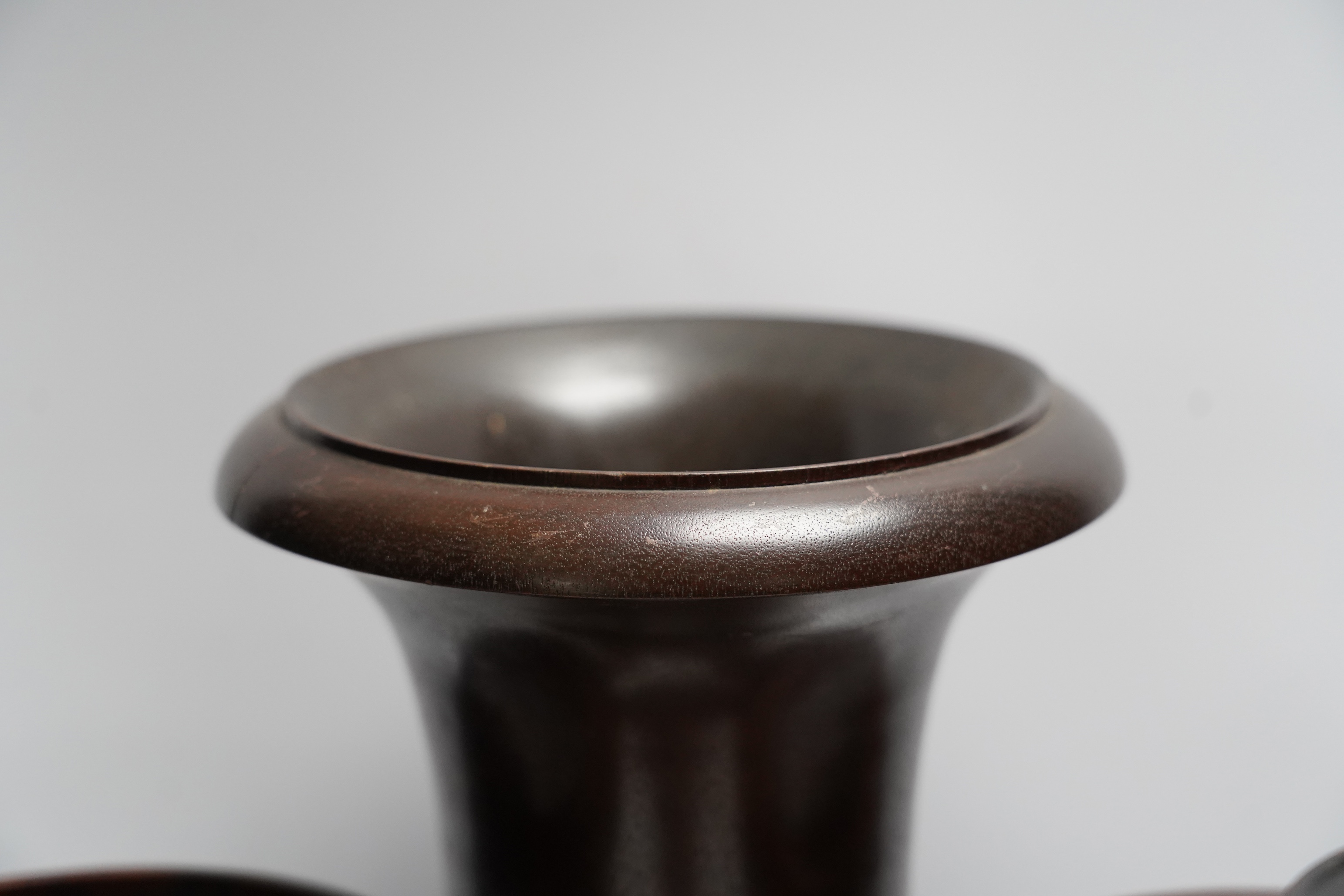 A mixed group of decorative treen effects, tall vases, candle stands etc, tallest 36cm